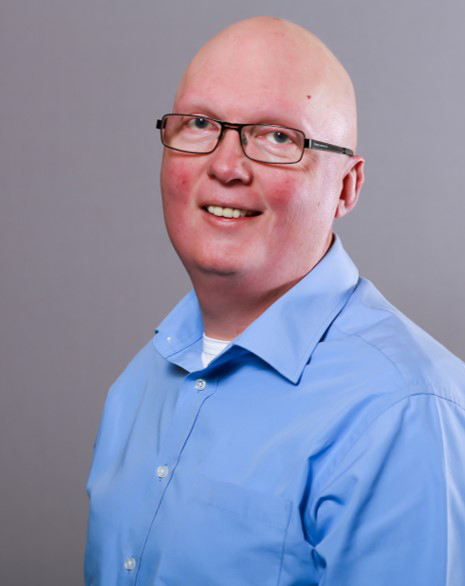 Headshot of Dr. Michael Baynham.