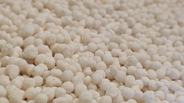 White fertilizer balls created using the Haber Bosch reaction. 